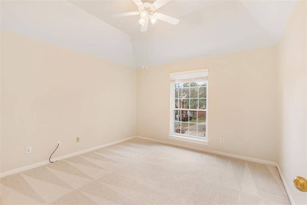 One of the three spacious upstairs bedrooms; this one overlooks the mature trees.