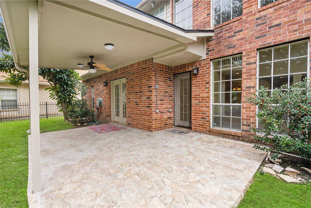 Enjoy coffee in the morning or a cool drink in the evening in any weather under the covered patio, with an entrance/exit through the primary bedroom and living room.