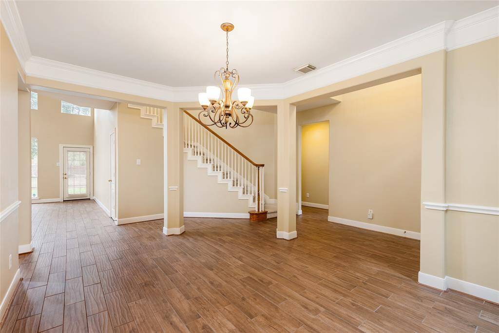 As you enter the home, you're greeted by the open space. The outside scenery follows you inside, from the front door all the way to the back door.