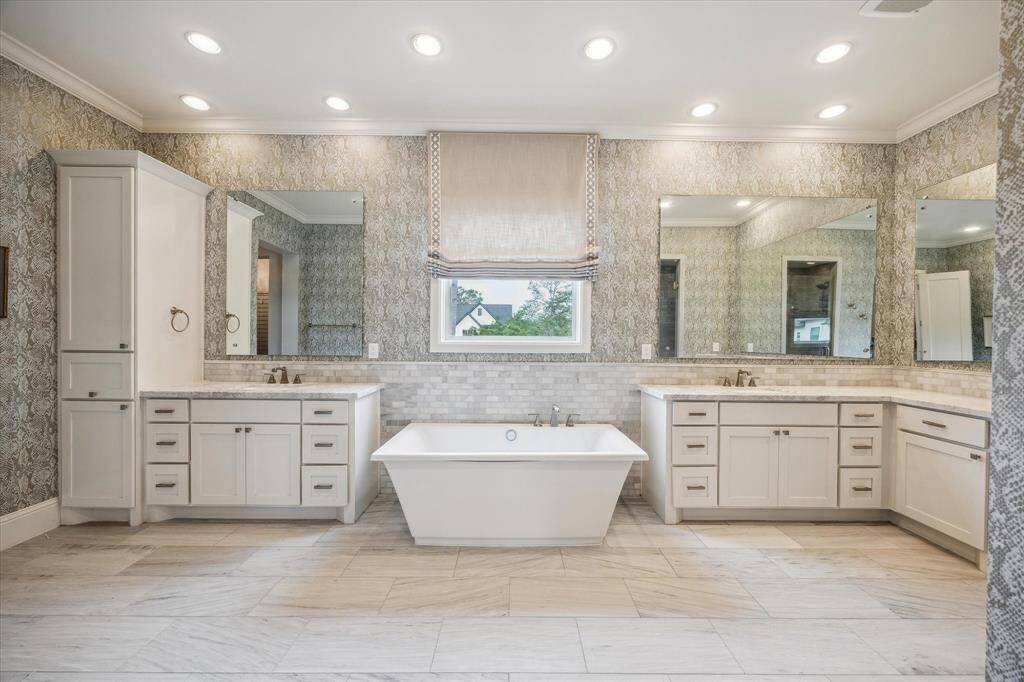 Spa-like primary bath with soaking tub and separate shower