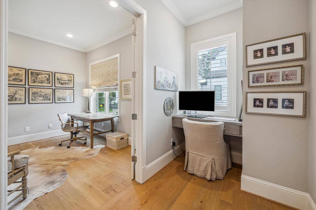 Another view of the study/flex room which has pocket doors to primary bedroom and French doors to the second floor landing area.  Also shown is an additional desk nook.
