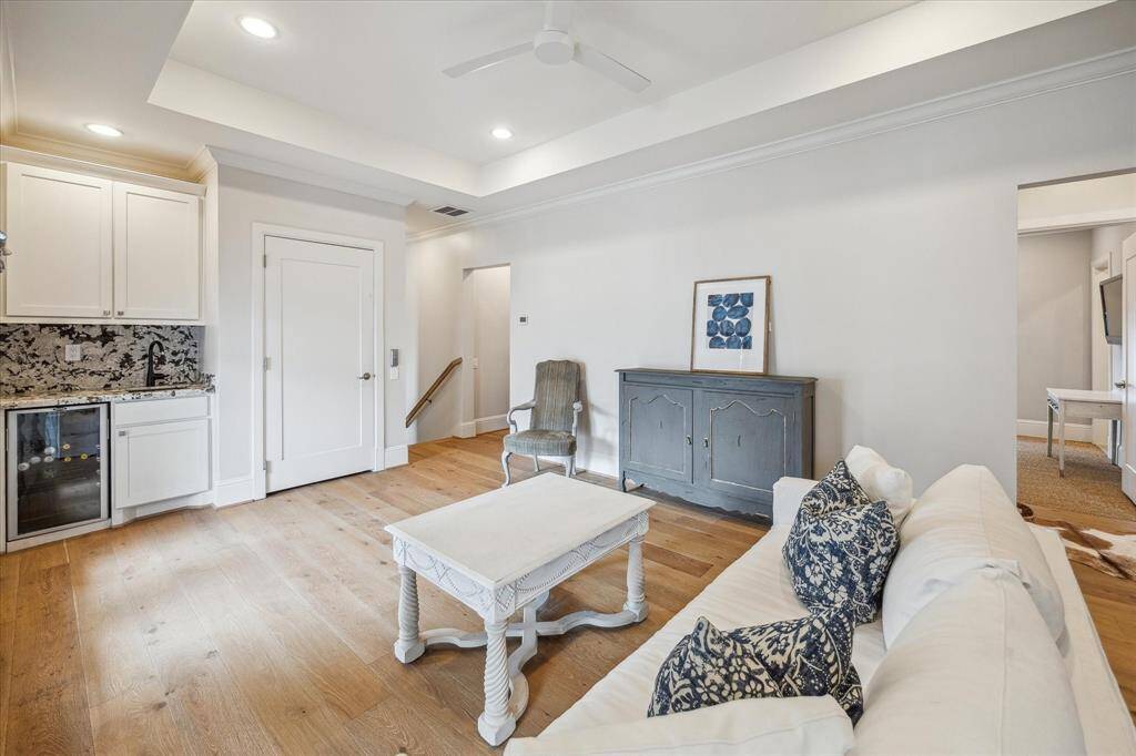Third floor game room with wet bar and beverage refrigerator
