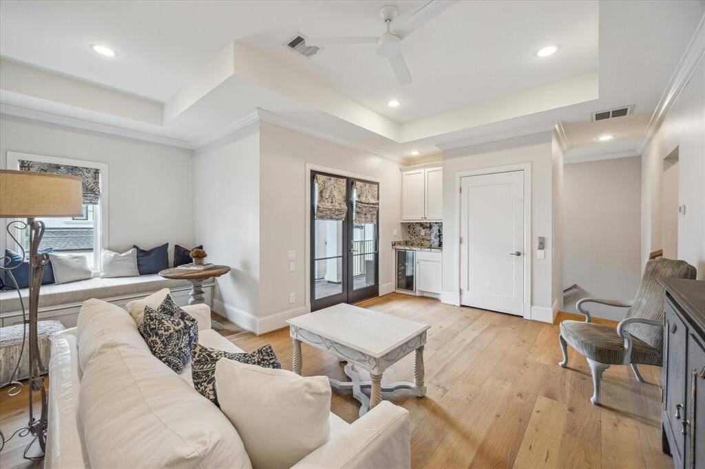 Another view of the game room/second living area with doors opening to the balcony