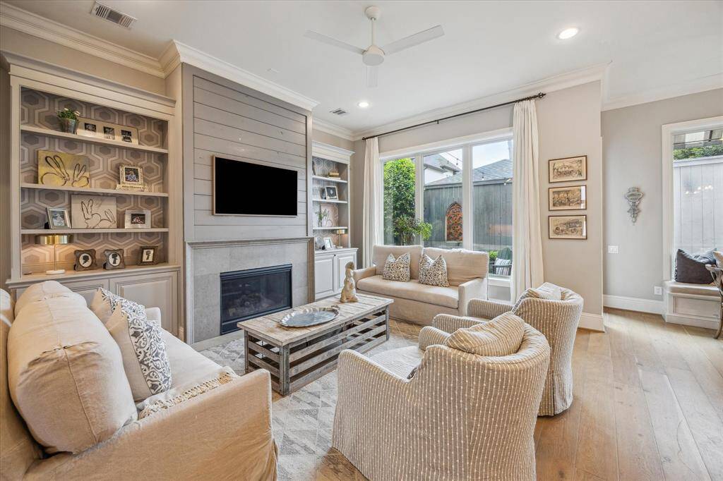 First floor living with gas log fireplace and built-ins