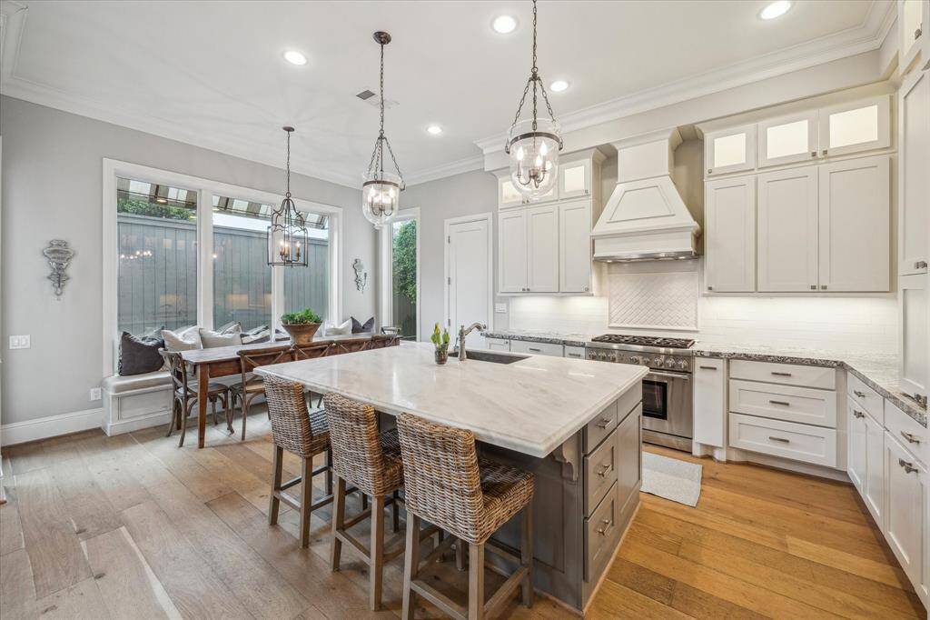 Dream kitchen with large island and Thermador six burner range