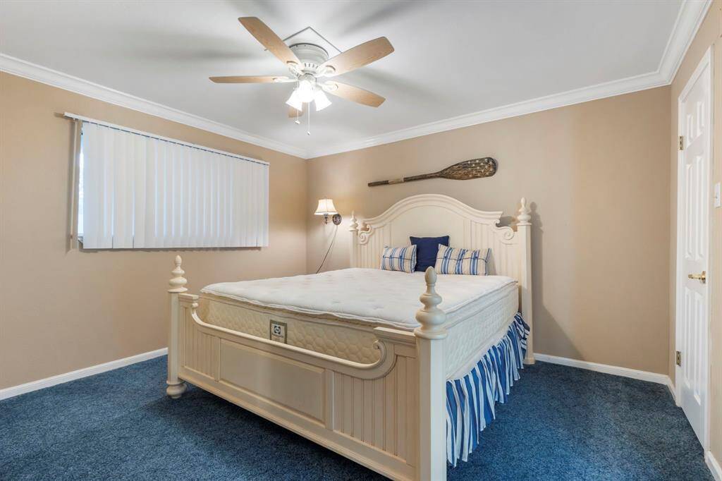 The spacious bedroom is located to the right as you enter the home.