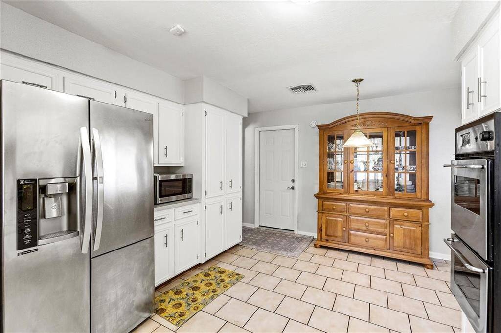 A view of the breakfast area and door that leads to the garage and laundry area.