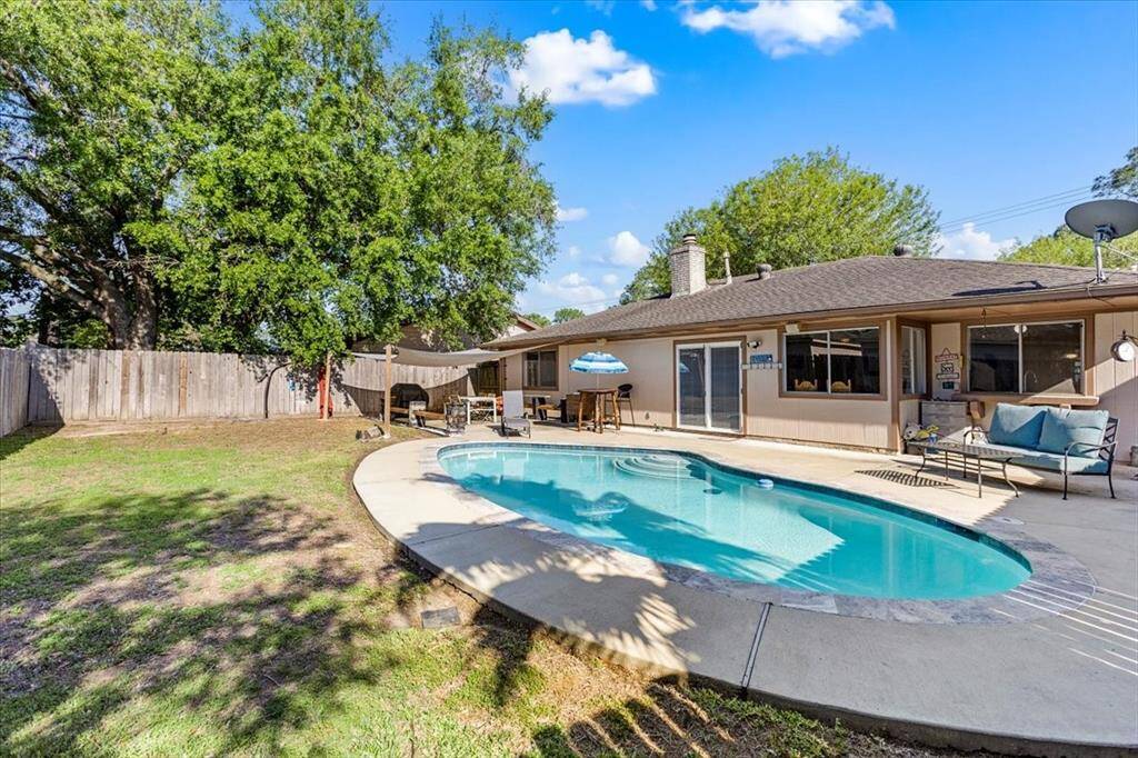 A nice sized backyard with a lovely pool for all of your Summertime relaxation.