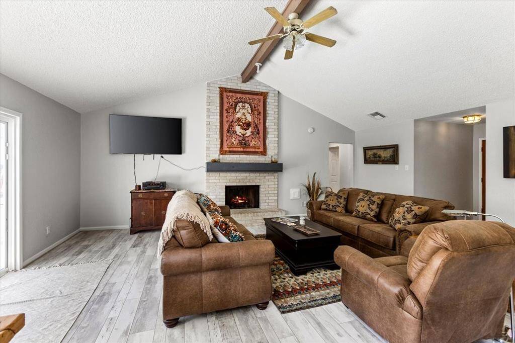 A nice sized family room with cathedral ceilings and plenty of space for family gatherings.