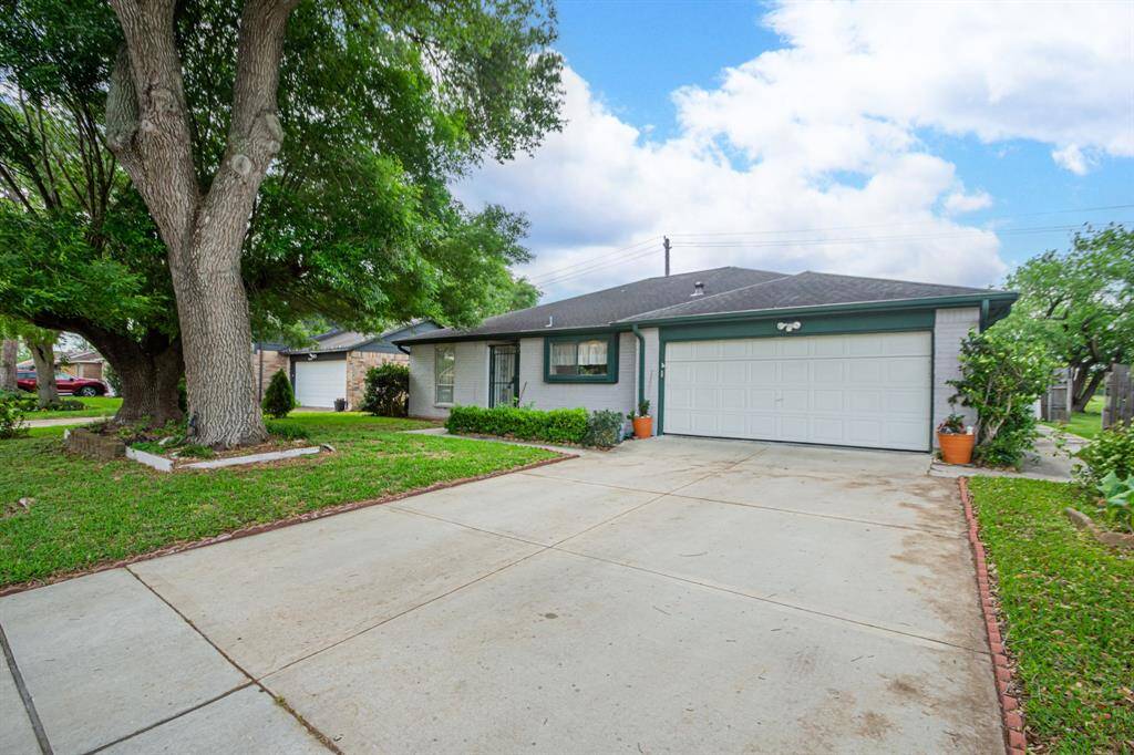 Large double wide driveway with a two car gargage for extra storage or toys
