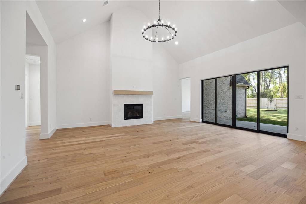 Sliding glass doors lead to Back Porch - perfect for Indoor/Outdoor Entertaining!