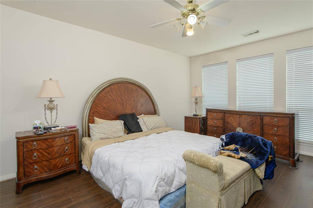 Spacious Master bedroom, No carpet and ceiling fan.