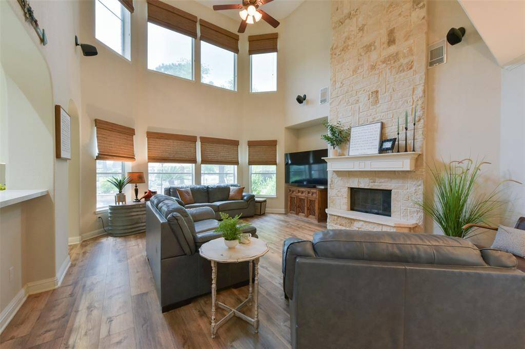 High ceilings and multiple windows give this two-story family room an open, bright feeling.