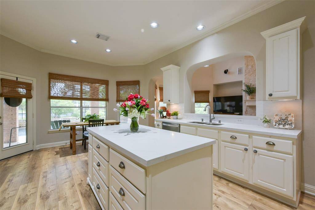 Tons of windows in the kitchen allow for beautiful views of your backyard oasis.