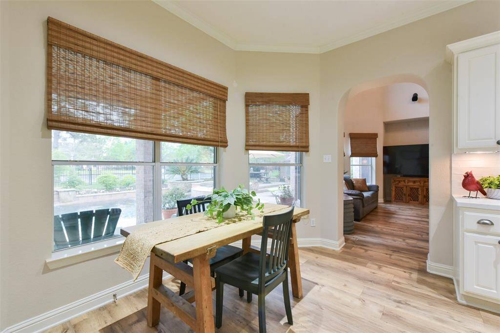 Large eat-in breakfast area overlooks the beautiful pool and neighborhood pond.