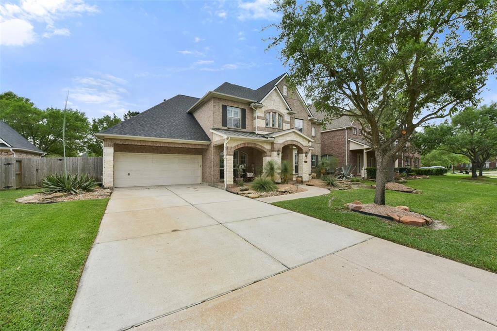 Long, double-wide driveway and a three-car tandem garage with recent paint and epoxy flooring throughout. Plenty of space for cars and toys!