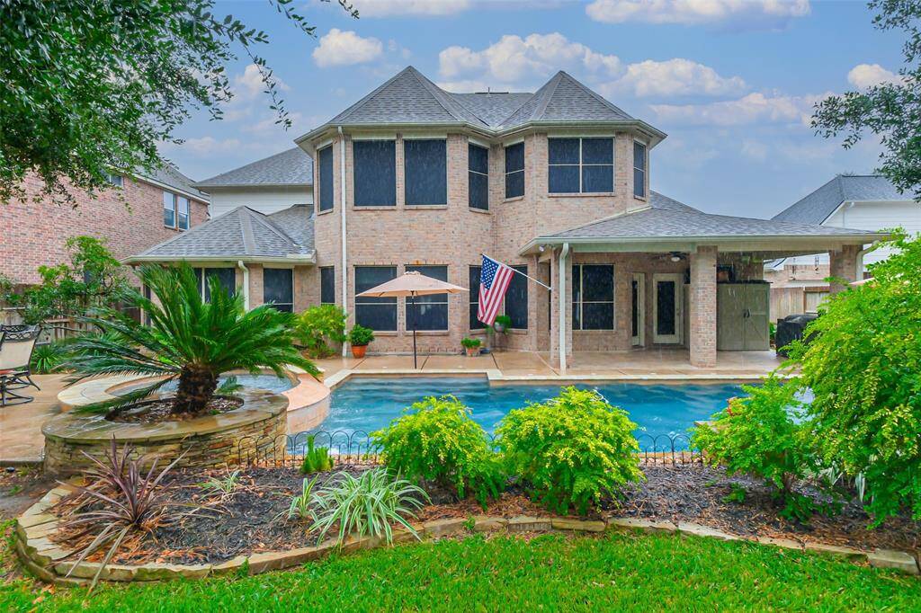 Lush landscape around the pool gives you just enough privacy while still being able to enjoy the view of the pond.