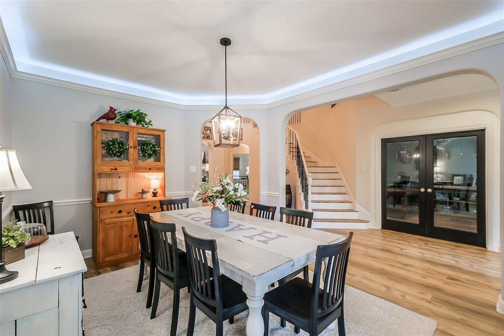 Large formal dining room right off the entry with recent fixtures and uplighting. Updated French doors lead to the home office/study.
