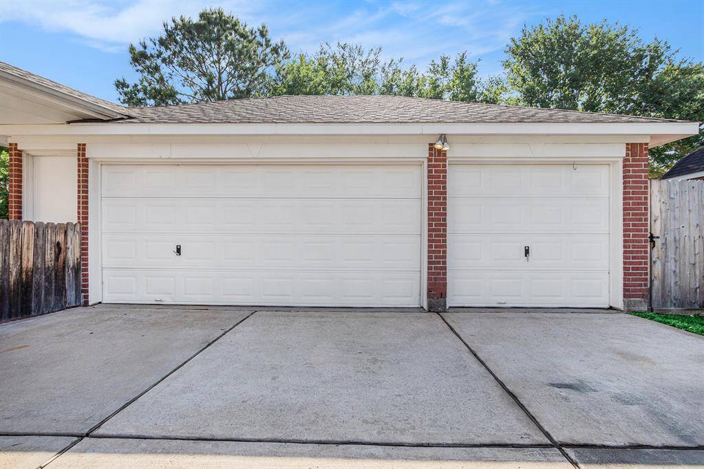 3-car detached garage. One bay has been converted into full storage area