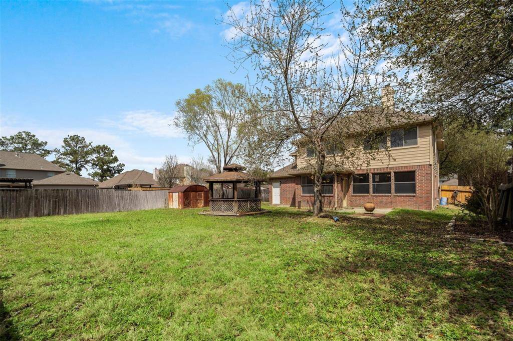 Huge Backyard with a double wide gate to store a boat or trailer on the left side of the home