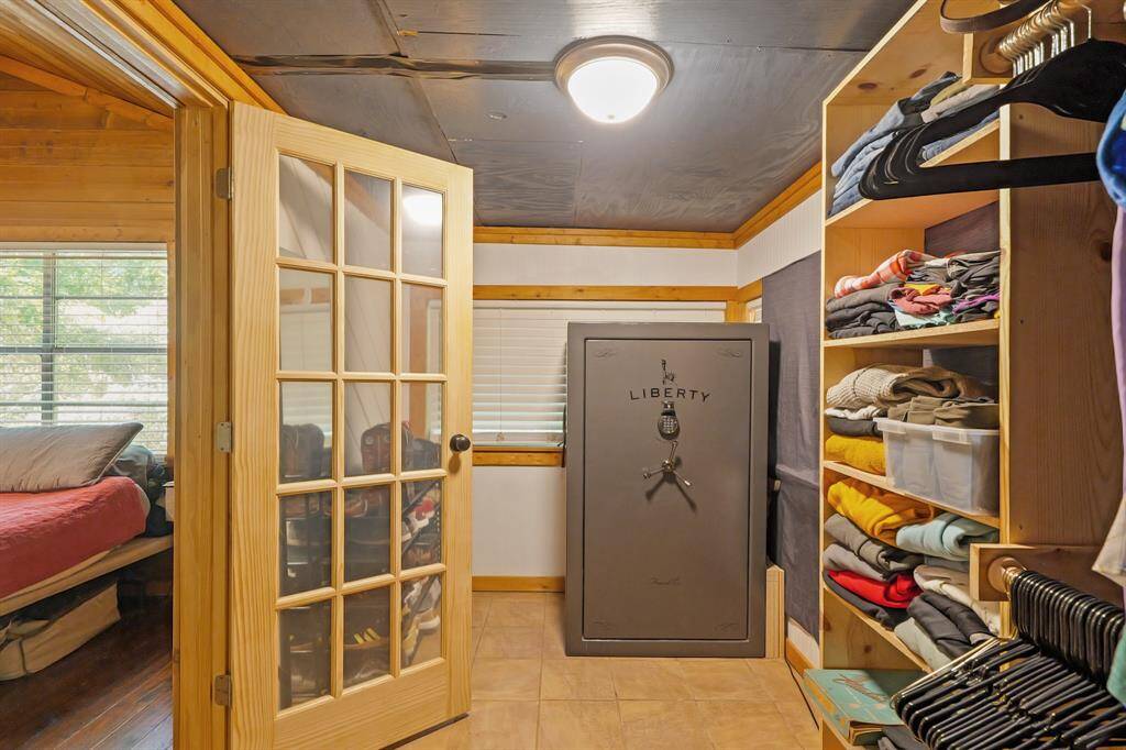 Sunroom area remodeled for extra closet space. Safe included with home.