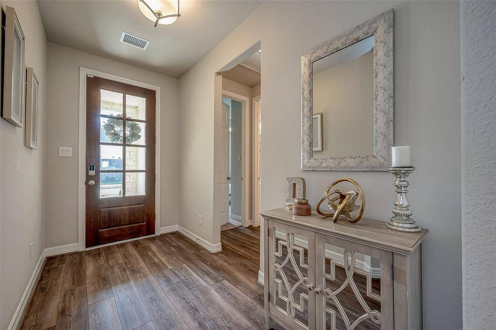 Beautiful expansive foyer with Jack and Jill secondary rooms to the left of entering.