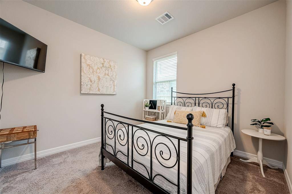 Guest room in center of home across from formal dining room