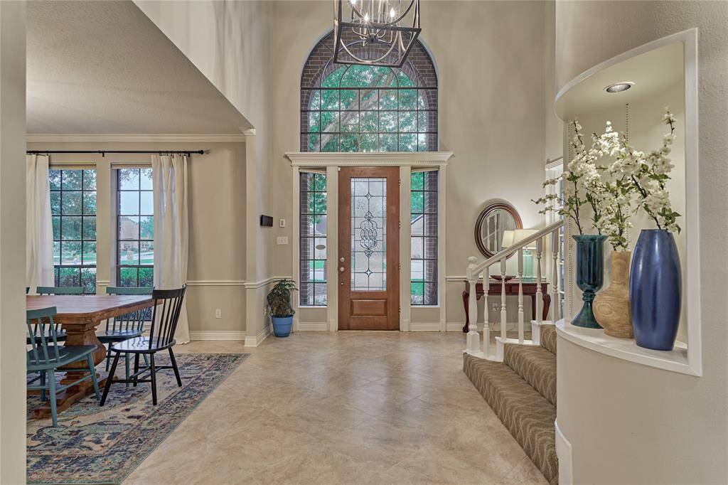 A view of the grand foyer with dining room to the left.