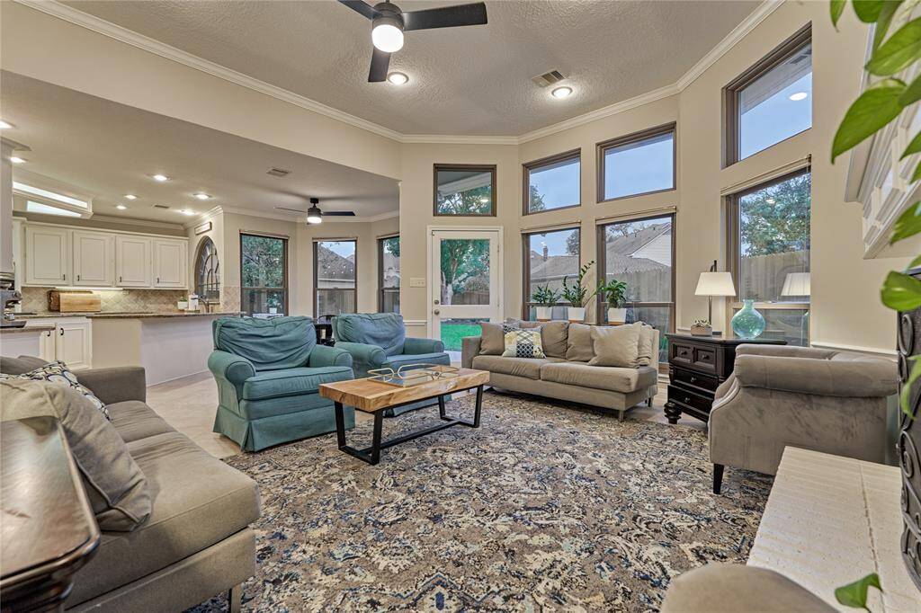 The family room and kitchen combine seamlessly with it's open concept and features floor-to-ceiling (Anderson) windows bringing the outdoors in.