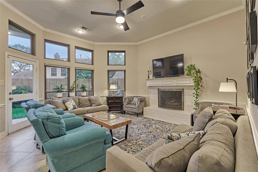 The family room features a warm and cozy fireplace for the cooler months.