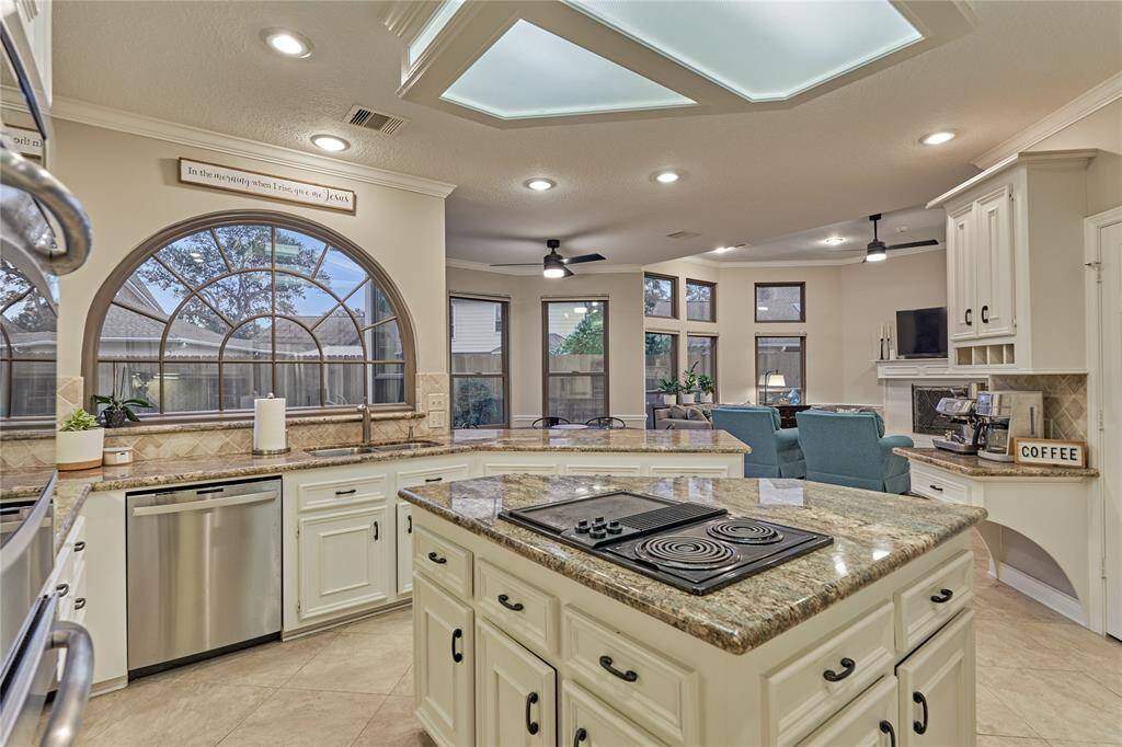For the chef of the house, a center island with cooktop provides an additional prepping area and  storage space.