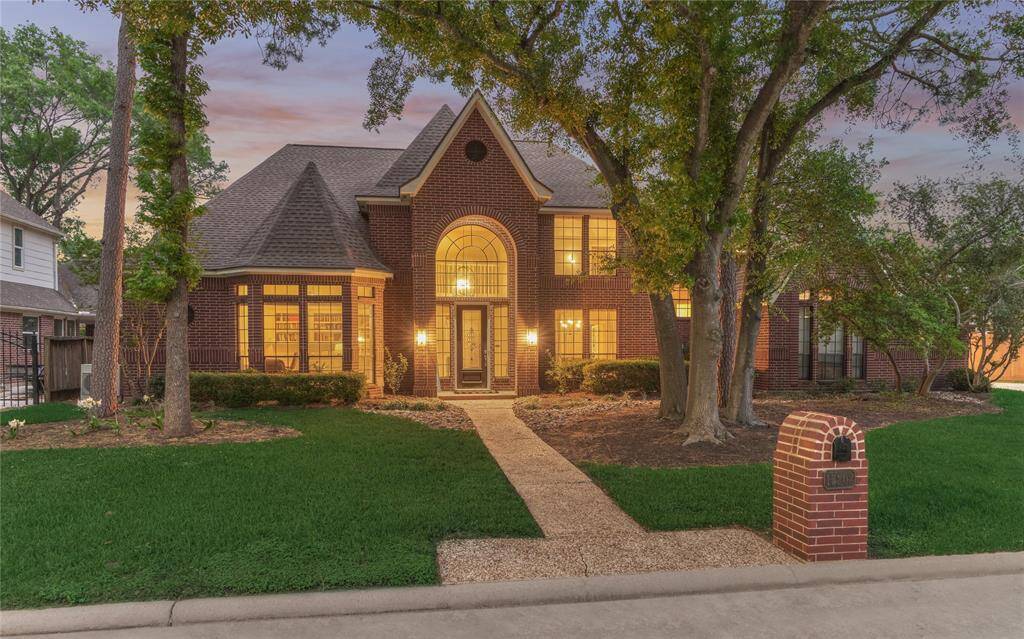 This fabulous home was custom-built by Mark Hala and enjoys 3,848sf of living space on an oversized lot with mature trees and foliage.