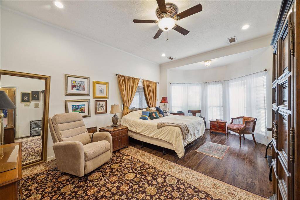 PRIMARY BEDROOM WITH BAY WINDOW PUSHOUT IS LOCATED DOWNSTAIRS.