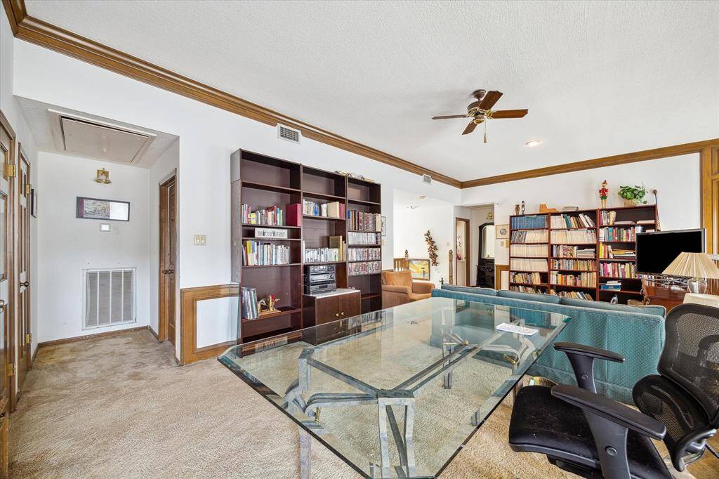 ANOTHER VIEW OF THE GAMEROOM AND HALL LEADING TO BEDROOMS.