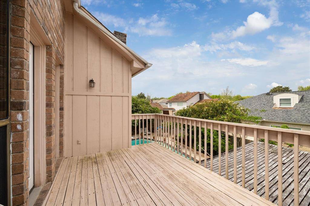 BEDROOM 4 LEADS TO THIS PRIVATE BALCONY OVERLOOKING THE POOL.