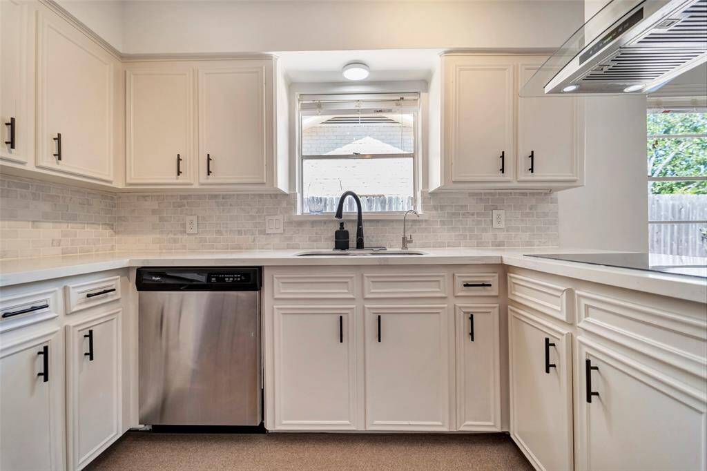 The kitchen features high-end appliances and ample counter space.