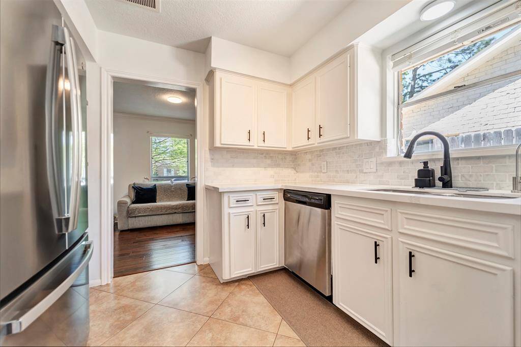 Plenty of natural lighting throughout the home and especially in the kitchen and breakfast room. The doorway pictured above leads into the flex space.