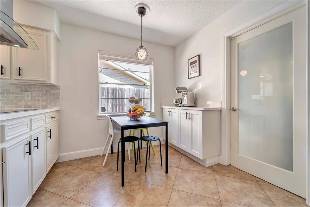 The breakfast room just off of the kitchen offers a bright, airy feel.