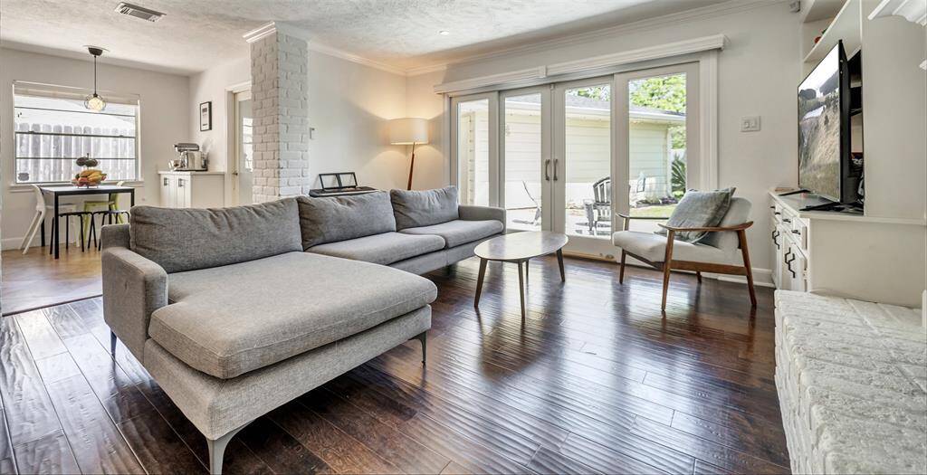 In between the kitchen and formal dining room, the family room really is the heart of this home! The floor to ceiling windows and deluxe energy efficient French doors to the backyard space fill the room with an abundance of natural lighting.