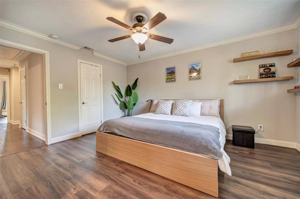 The primary bedroom suite is generously sized and easily accommodates a king-sized bed. This room has two walk-in closets and looks out into the backyard.