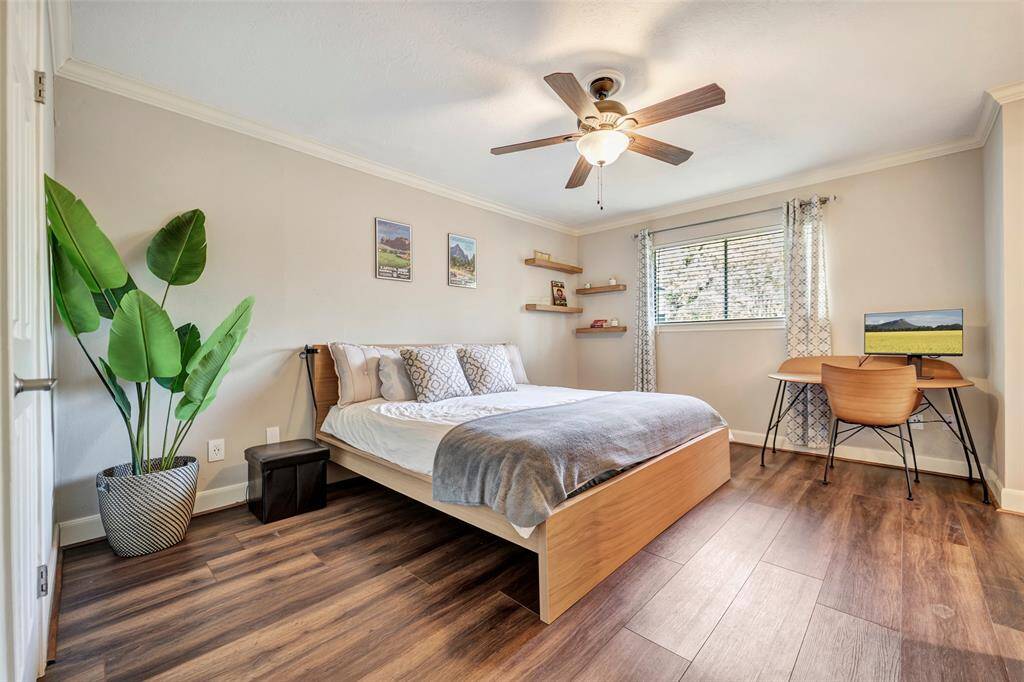 Another view of the light and airy primary bedroom suite.