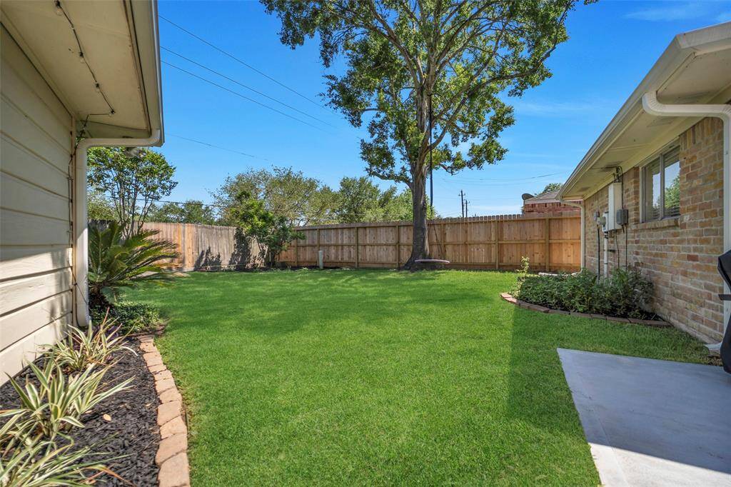 This oversized backyard is the perfect space for kids and pets to play! The property backs up to Terry Hershey Park - a beautiful trail and park for families of all ages to enjoy.