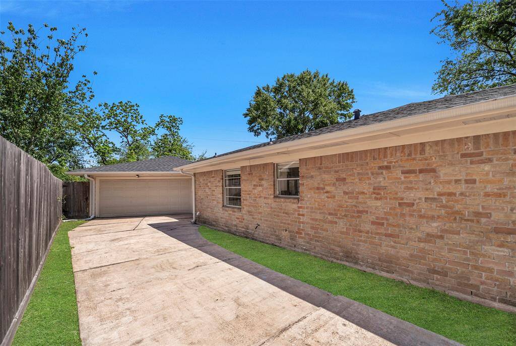 The long driveway leading up to two car detached garage provides plenty of room for parking.