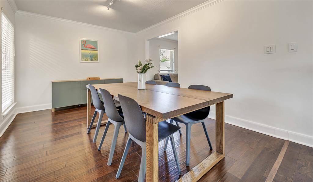 The formal dining room has plenty of room to accommodate large dinner parties! the doorway pictured on the right leads into the flex space.