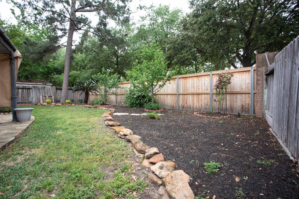 Nice flower beds contain flowering dogwood, and other flowering plants...space for your favorites.