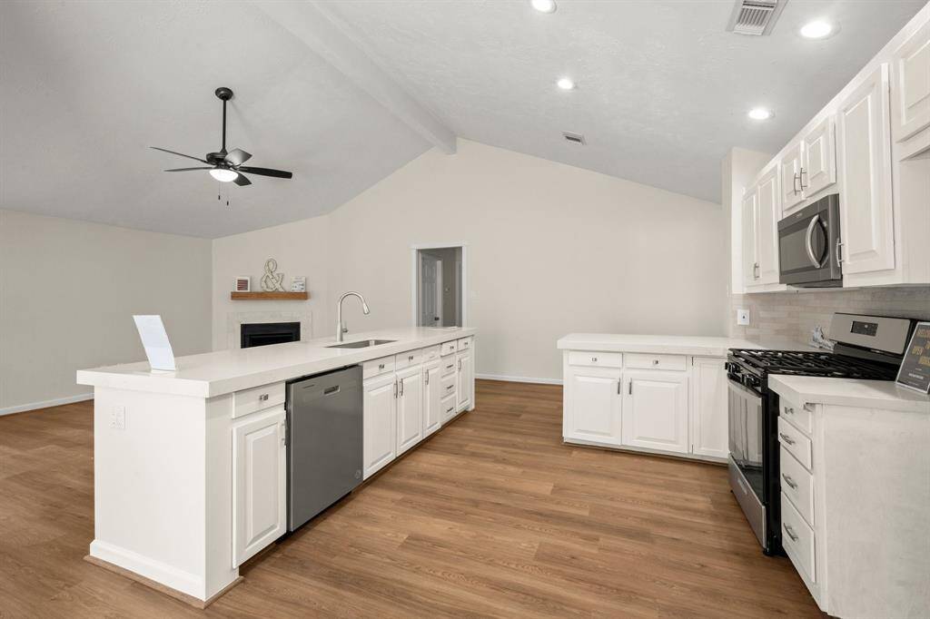 Painted cabinets with new hardware, and brand-new stainless steel appliances