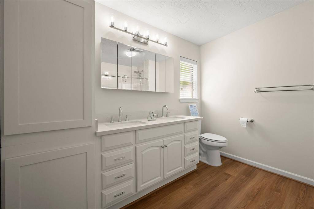 painted cabinets and walls, and stylish lighting