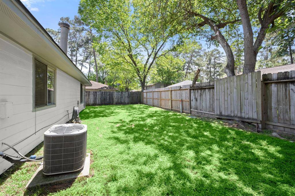 peaceful backyard with cleaned garden beds, mowed lawn,