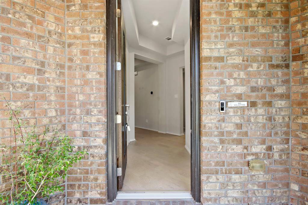 Enter the front door with covered patio and be welcomed by gorgeous wood floors that pave your way throughout the home.