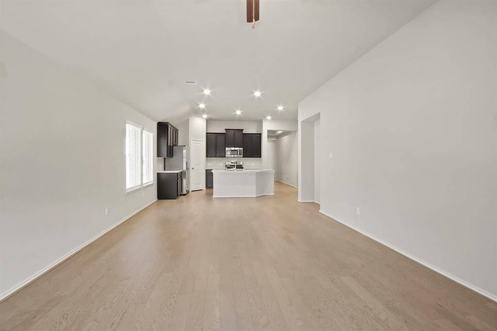 The kitchen is a chef’s delight, featuring granite countertops and sleek stainless steel appliances for both style and function. Recent Refrigerator included!